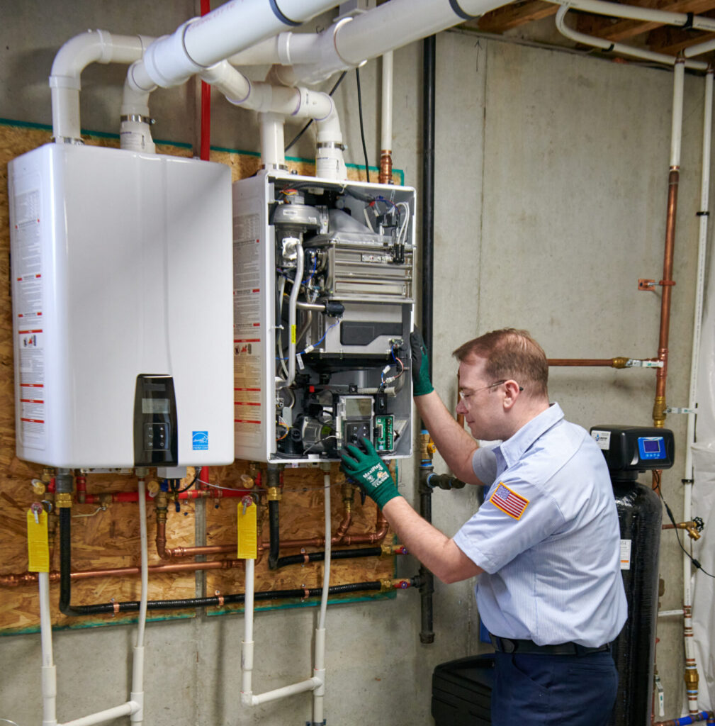 plumber working on tankless water heater