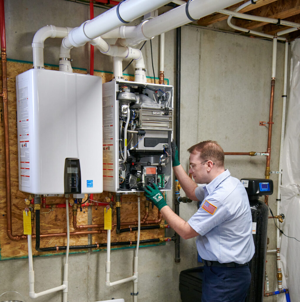 plumber installing new tankless water heater