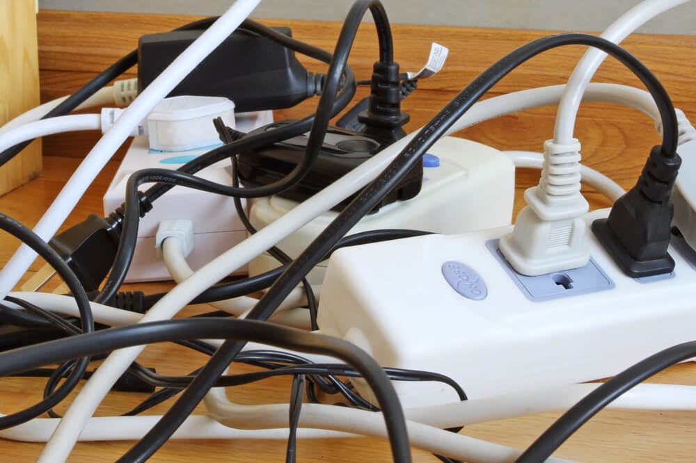 overloaded power strips with too many wires. This is unsafe.