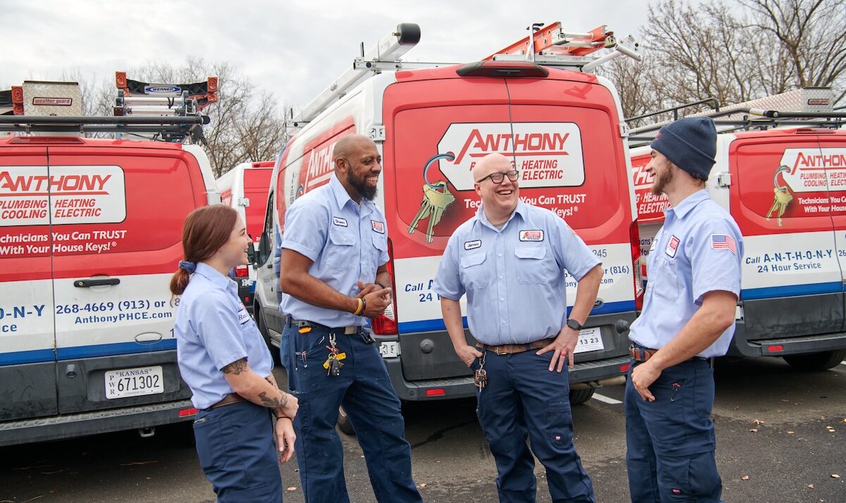 technicians laughing together in a group