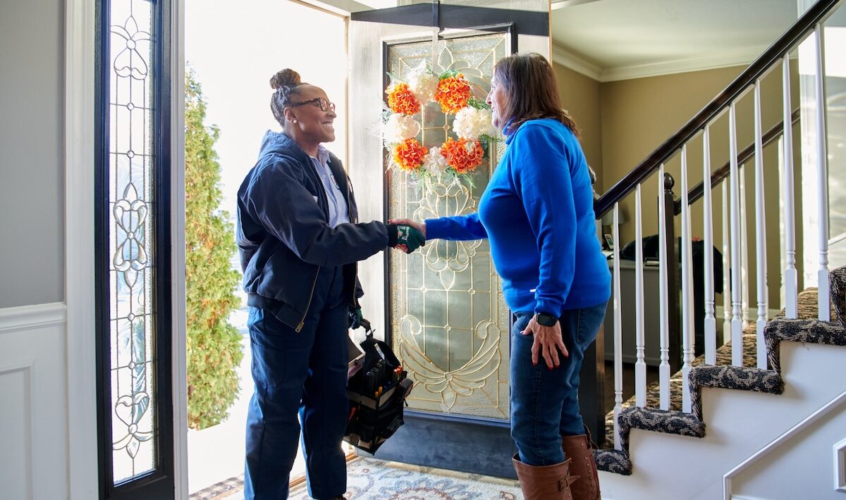 technician and home owner greeting each other