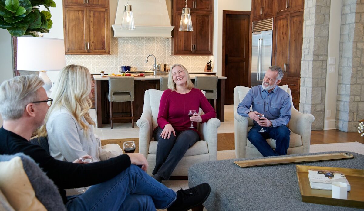 homeowners happily speaking to each other in the living room