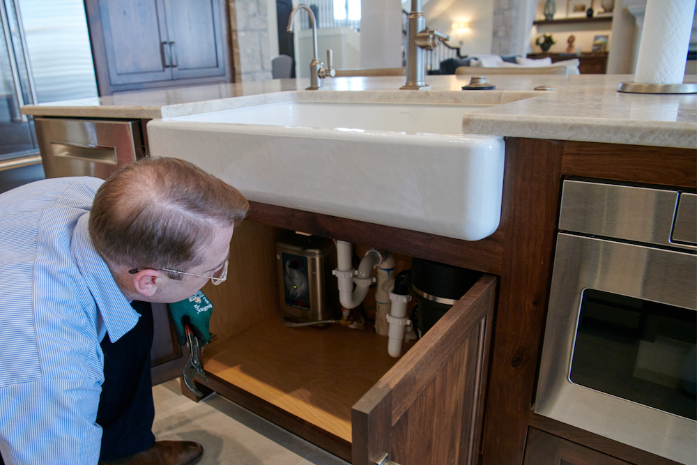 Technician inspecting pipes