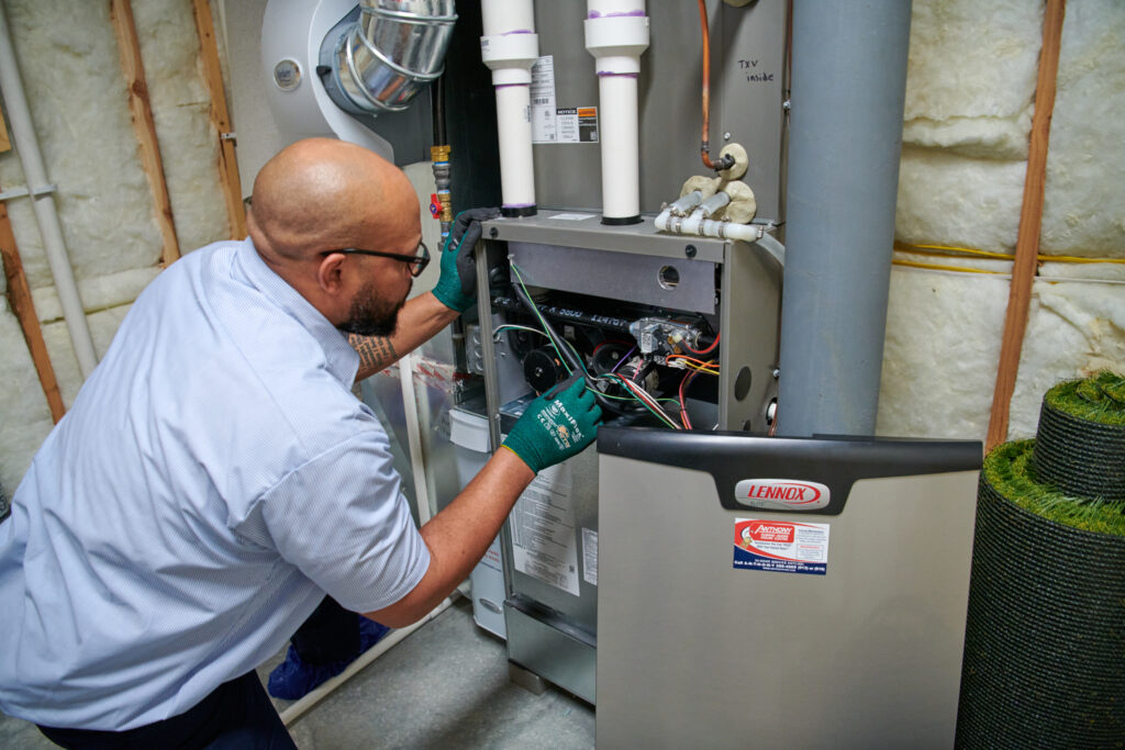 hvac tech installing a new furnace