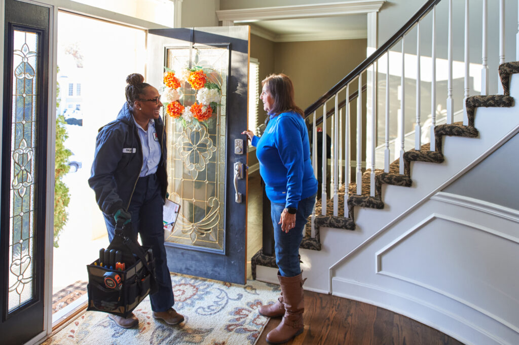 Checklist: How to Prepare Your Furnace for Winter 1 furnace inspection tech entering client home